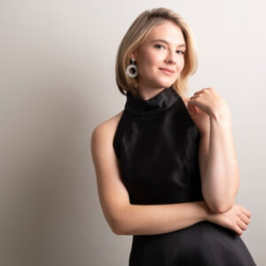 Erika Baikoff in black concert dress