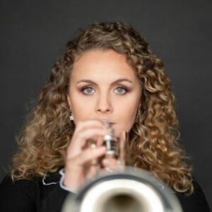 Matilda Lloyd with trumpet, close up