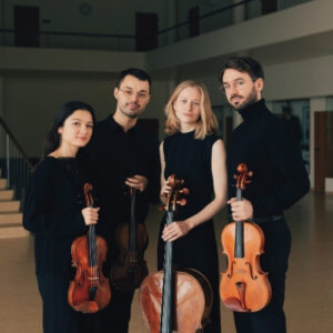 Four members of NOVO String Quartet standing, with instruments