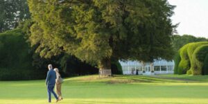 People walking in grounds of Hovingham Hall